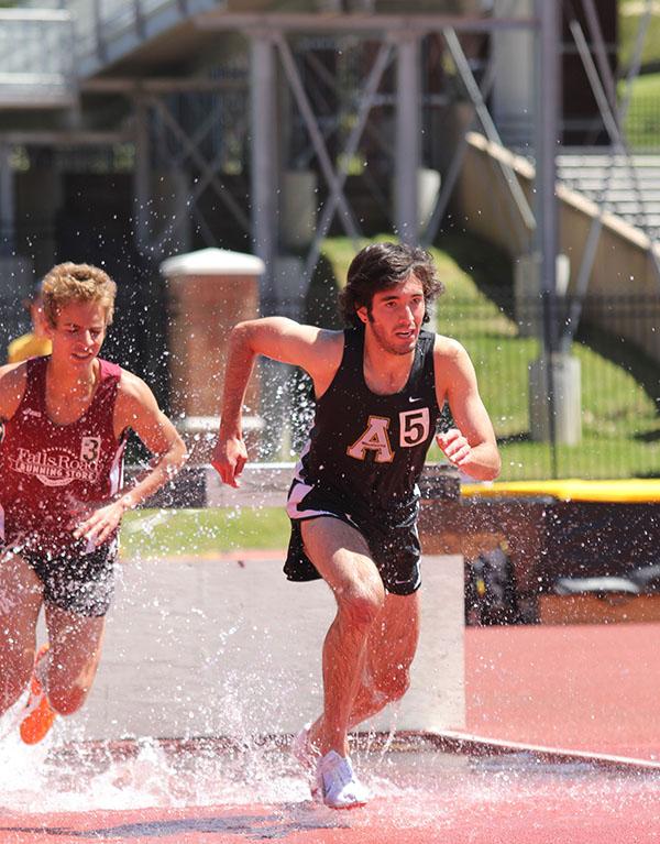 Freshmen Kyle McFloy and Mason Rivera compete in the Steeple Chase in Friday afternoon’s track meet.  Paul Heckert  |  The Appalachian