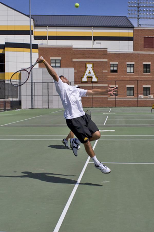 Junior Andrew McKinnon hits the ball against College of Charleston in a home win for the Mountaineers April 13.  Courtney Roskos  |  The Appalachian 