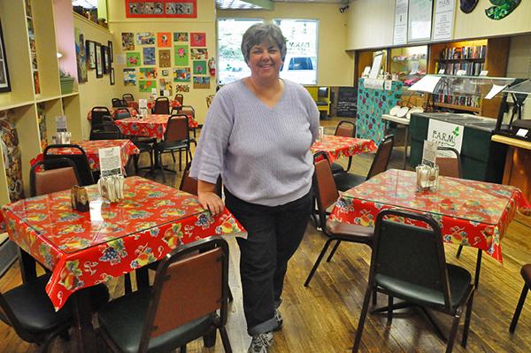 F.A.R.M. Café Executive Director Renee Boughman stands in the newly-completed restaurant. The café, which opens Tuesday, is a non-profit organization that runs almost entirely with volunteers and seeks to provide wholesome meals for everyone.  Photo by Maggie Cozens  |  The Appalachian