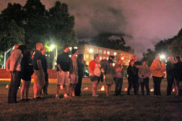 Students gather on Duck Pond Field to commemorate the recent passing of fellow student Paige Kriegel. The students organized and held a candlelight vigil, sang songs and shared memories in Kriegel's honor.  Maggie Cozens | The Appalachian 