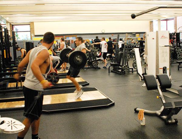 Students exercise at the Quinn Center, one of the three gyms on campus. The center includes free weights, a track, racquetball courts and several other amenities. Conor McClure | The Appalachian