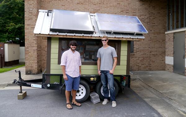 Grant Warner and Nick Hoit, president and vice president of the Solar Club, stand with DAISEE, a power-generating trailer. Warner and Hoit are hoping to use the trailer this weekend to supply a portion of the energy for stage performances at Music on the Mountaintop. Conor McClure | The Appalachian