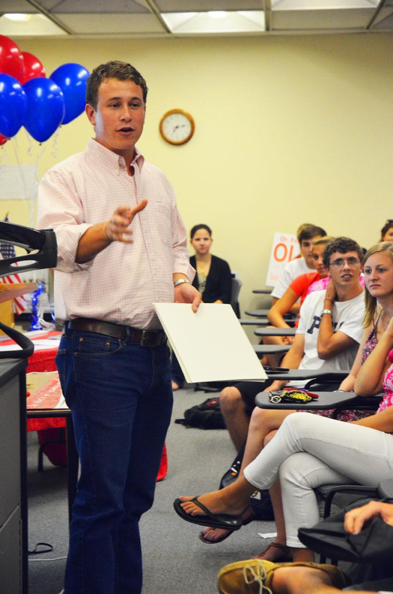 Maggie Cozens | The Appalachian Vice chair of the Watauga Republican party and candidate for county commissioner Tommy Adams addresses a group of Appalachian students during the RNC watch party Wednesday night. The watch party, held by the College Republicans, invited all interested students to come watch Paul Ryan officially accept his vice presidential nomination. Maggie Cozens | The Appalachian