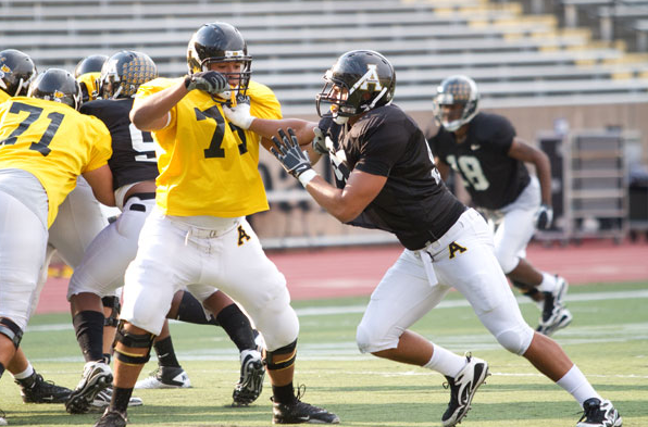 John Rizor pushes past an offensive lineman during a 2010 practice. ASU football announced Tuesday that Rizor had been dismissed, effective immediately. Photo by Zack Wilson | The Appalachian