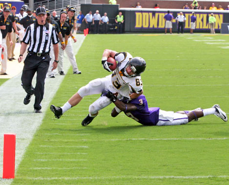 Freshman wide receiver Simms McElfresh struggles to make it to end zone during last weekend's game against ECU. Appalachian lost to the Buccaneers 13-35. Amy Birner | The Appalachian