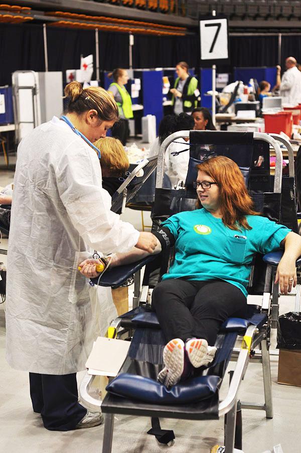 Sophomore religious studies major Kaylee Godfrey donates blood during the 6th annual homecoming Blood Drive Wednesday in the Holmes Convocation Center. The university holds the state record with 1,315 pints of blood. Joey Johnson | The Appalachian