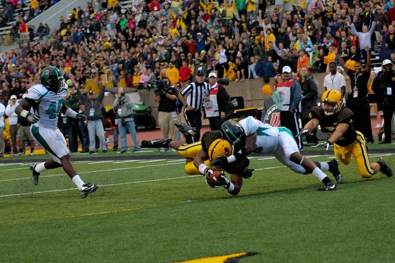 Junior Rightback Michael Frazier brushes off a Coastal Carolina defender, making it into the in-zone for a fourth quarter touchdown. The Mountaineers had a 55-14 win over the Chanticleers. Paul Heckert | The Appalachian