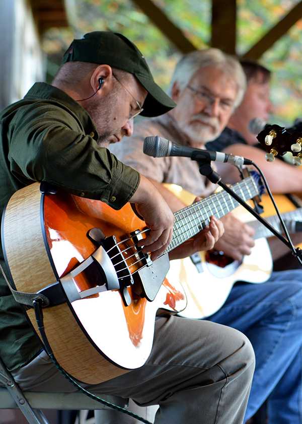 Joel Landsberg of the Kruger Brothers and Charles Welch perform Saturday evening in Todd at the Doc Watson Tribute Concert. The show was held to honor Doc Watson, a Boone musical legend who died this past summer. Olivia Wilkes | The Appalachian