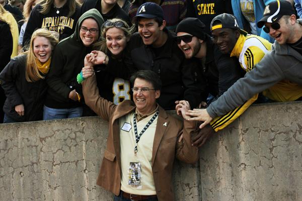 Pat McCrory, republican canidate for Governor, pauses for a picture with students at Saturday's game against Wofford. McCrory was in attendence at the game and tailgated with student organizations. Paul Heckert | The Appalachian