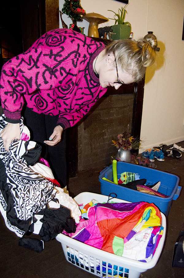 Junior public relations major Shady Kimzey looks through a collection of thrift store items in search of a costume. Kimzey and her roommates keep baskets of thrift store costumes in their house at all times to use as outfits for special occasions such as Halloween. Olivia Wilkes | The Appalachian