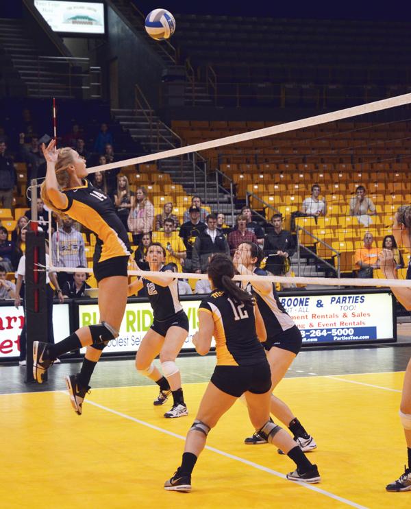 Sophomore middle blocker Lauren Gray prepares to hit the ball during Saturday's game against the Citadel. Appalachian emerged victorious with a final score of 3-1. Maggie Cozens | The Appalachian