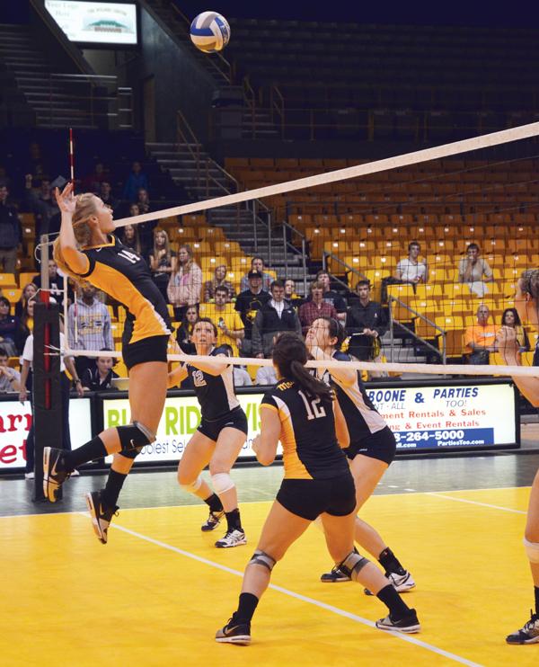 Sophomore middle blocker Lauren Gray prepares to hit the ball during Saturday's game against the Citadel. Appalachian emerged victorious with a final score of 3-1. Maggie Cozens | The Appalachian