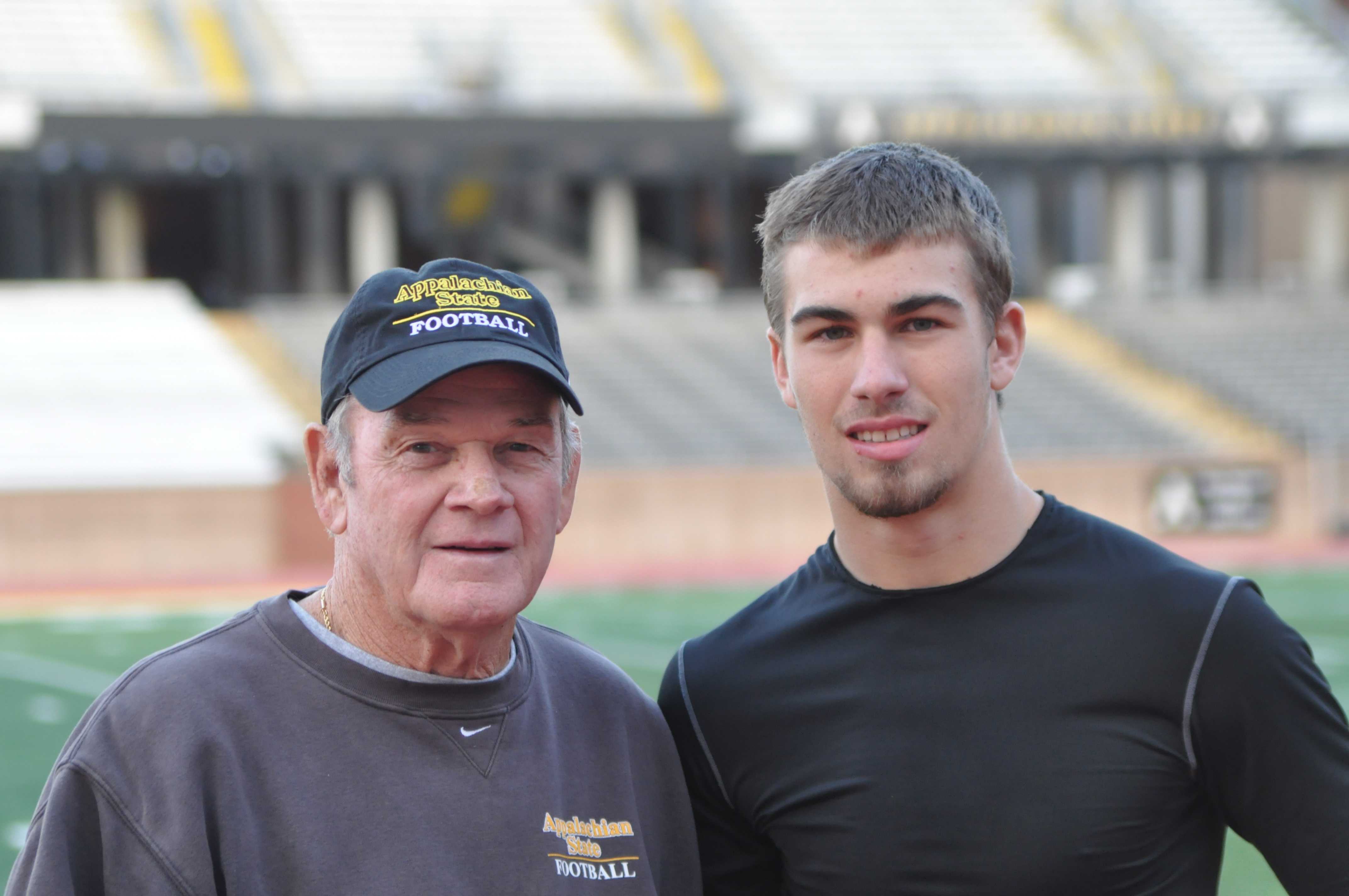 Head Coach Jerry Moore and redshirt freshman wide receiver Trey Kavanaugh stand together at practice Tuesday afternoon. Kavanaugh is Moore's grandson. Anne Buie | The Appalachian 
