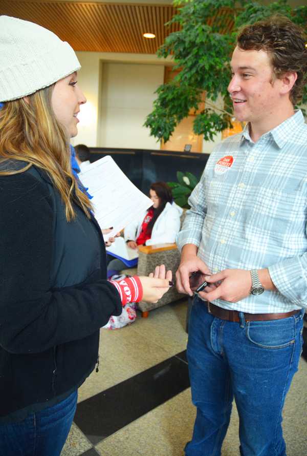 Candidate for Watauga County Commissioner Tommy Adams speaks with sophomore spanish major Nicole Salmon at last Monday's Rock the Vote event. Several candidates have spent considerable time on campus during this election season to encourage students to participate in early voting. Maggie Cozens | The Appalachin