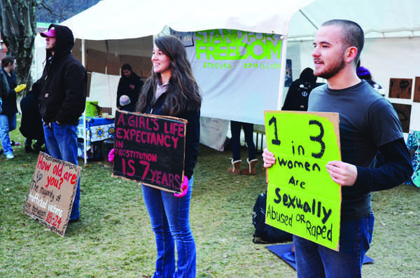 Freshman undecided Antonia Meyers stands with sophomore international criminal justice major Jesse Wilson for the Stand for Freedom event on Sanford Mall Wednesday evening. The event, held by the International Justice Mission, invited all Appalachian students to stand all night to raise awareness for slavery taking place around the world today.  Maggie Cozens | The Appalachian