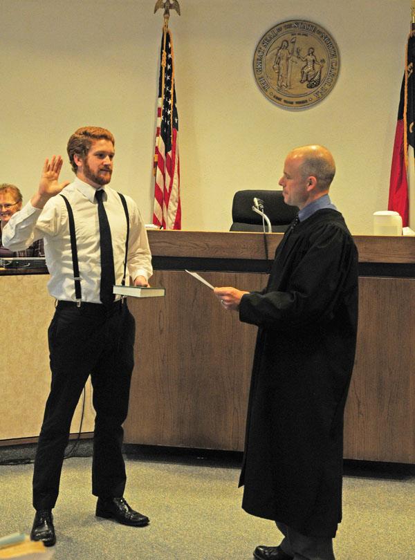 Senior marketing and economics major Chris Stevens is sworn into public office Monday morning as Soil and Water Conservation Supervisor for Watauga County. Joey Johnson | The Appalachian
