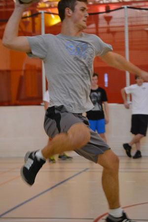 Freshman undecided major Alex Thompson winds back to throw.  As part of Delta Sigma Phi rush week, members of the fraternity played dodge ball on Sunday with potential candidates.