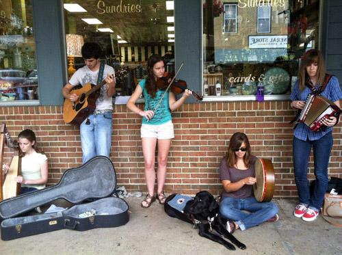 Members of the Dandeggans, a quintet of Appalachian State University student musicians, play at the storefront of Boone Drug. The band does not typically play live shows; however, they recently played for the grand opening of the new addition to the Plemmons Student Union. The Dandeggans can frequently be found playing to the residents of Boone on King Street.