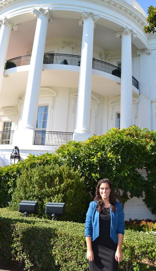 May 2012 graduate Emily Furfaro stands on the White House lawn during her Aug. 29 to Jan. 11 internship. 