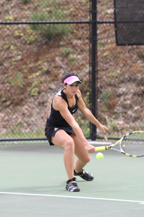 Senior Gabriela Celi returns the ball across the net in a game last fall against Western Carolina University.