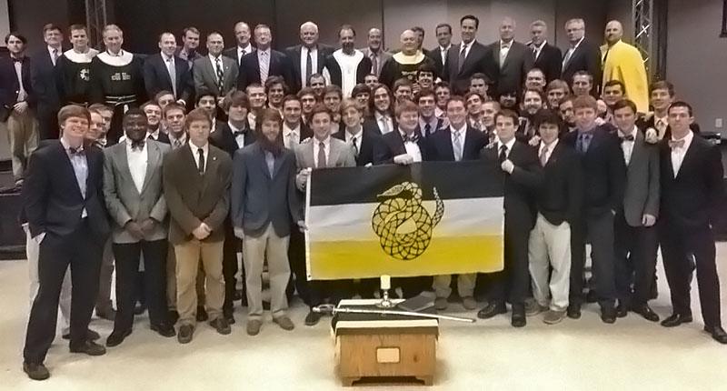 Brothers of the Kappa Epsilon chapter of Sigma Nu stand with original founding fathers at its Saturday initiation.  Nate Allen | Courtesy Photo