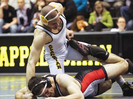 Former wrestler Kyle Blevins holds control of a Davidson opponent in a match last season.  Paul Heckert | The Appalachian