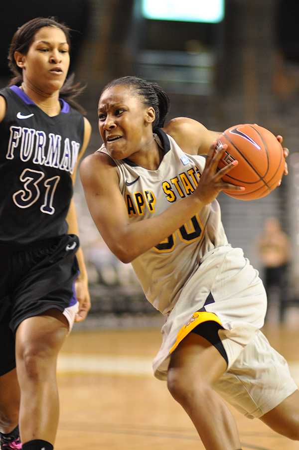 Senior guard Courtney Freeman rounds a Furman defender in Monday nights 68-58 win. 