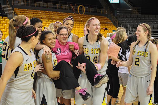 Head coach Darcie Vincent is paraded around by the women’s basketball team at the conclusion of Saturday’s game against Wofford. The win marked Vincent’s 100th career win as head coach at Appalachian State.  Justin Perry | The Appalachian 