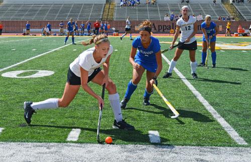 Freshman forward Hanna French attempts to keep the puck in play from a Delaware defender in a match last fall. The team recently gained six recruits for the 2013 spring season.  Aneisy Cardo | The Appalachian 