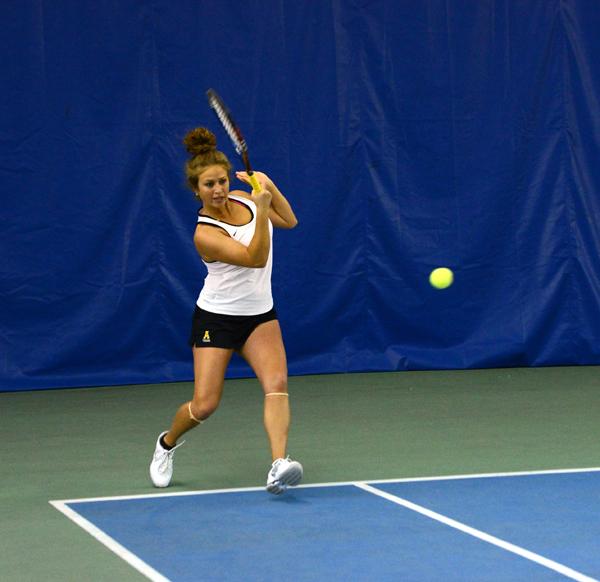 Senior Jennifer Ansari hits the ball Satuday afternoon during her doubles match versus East Tennessee State University at Yonahlossee Raquet Club. The Mountaineers lost their first match to ETSU 6-1.  Olivia Wilkes | The Appalachian