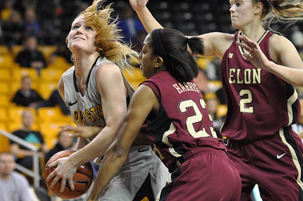 Senior forward Kelsey Sharkey fights to put the ball in the basket in Saturday afternoons 80-62 win against Elon. 