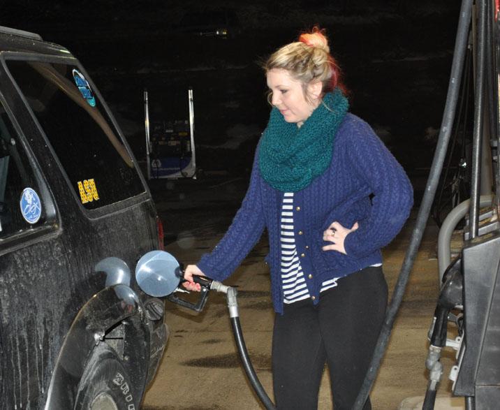 Sophomore art education major Ian Evans fills her tank at Carolina Petro in Boone. It costs approximately $60 to fill her Ford Explorer.  Maggie Boutwell  |  The Appalachian 