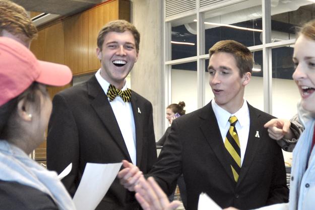 Presidential elect Dylan Russell (left) and vice presidential running mate Michael Page (right) celebrate while reading the offical results of the SGA elections Tuesday.  Justin Perry  |  The Appalachian