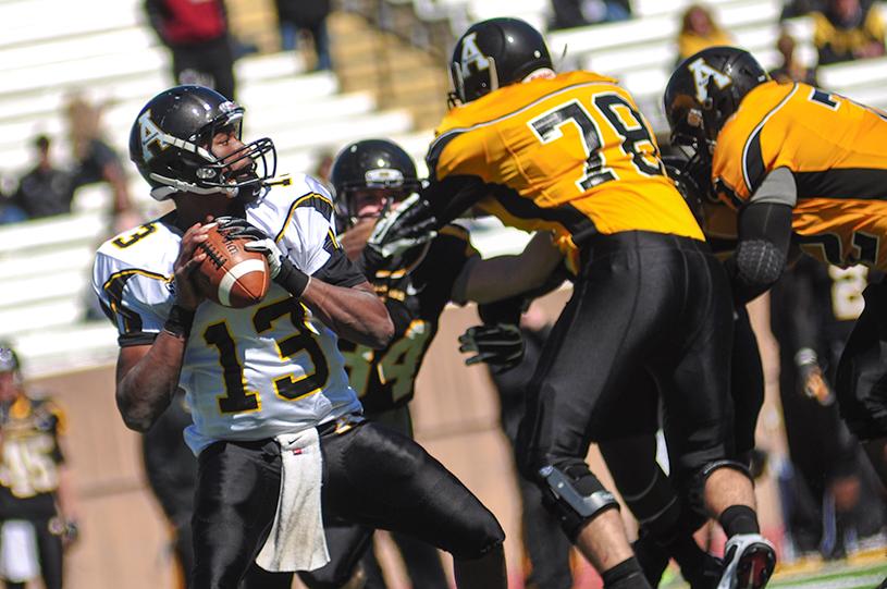 Sophomore defensive lineman Greg Hall looks for an opening during the 2013 spring game.  Justin Perry  |  The Appalachian