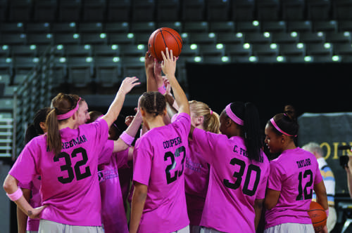 The Mountaineers gather together    before a game wearing their breast cancer awareness warm-up shirts. The team is losing four seniors and will need its new upperclassmen to become leaders.   Justin Perry  |  the Appalachian