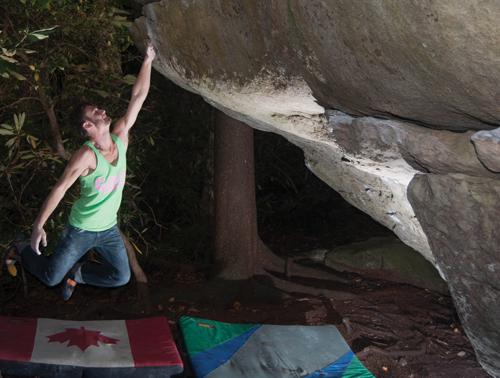 Senior criminal justice major Jeremy Parnell works on a boulder problem at Grandmother Mountain. Parnell will attend the Rocks for Research event this weekend in Charlotte.  Joey Johnson  |  The Appalachian