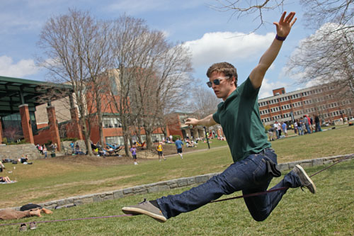 Sophomore recreation management major Matt Edwards takes advantage of the warm weather and slacklines on Sanford Mall on Monday afternoon. Tempuratures are expected to rise in the 70s Tuesday and Wednesday.  Paul Heckert  |  The Appalachian 