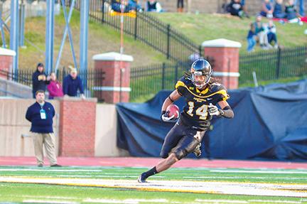 Junior wide receiver Sean Price carries the ball across the middle of the field in a game last season. Price led the team in receiving last year with 81 catches for 1,196 yards and eight touchdowns. Photo by Justin Perry  |  The Appalachian