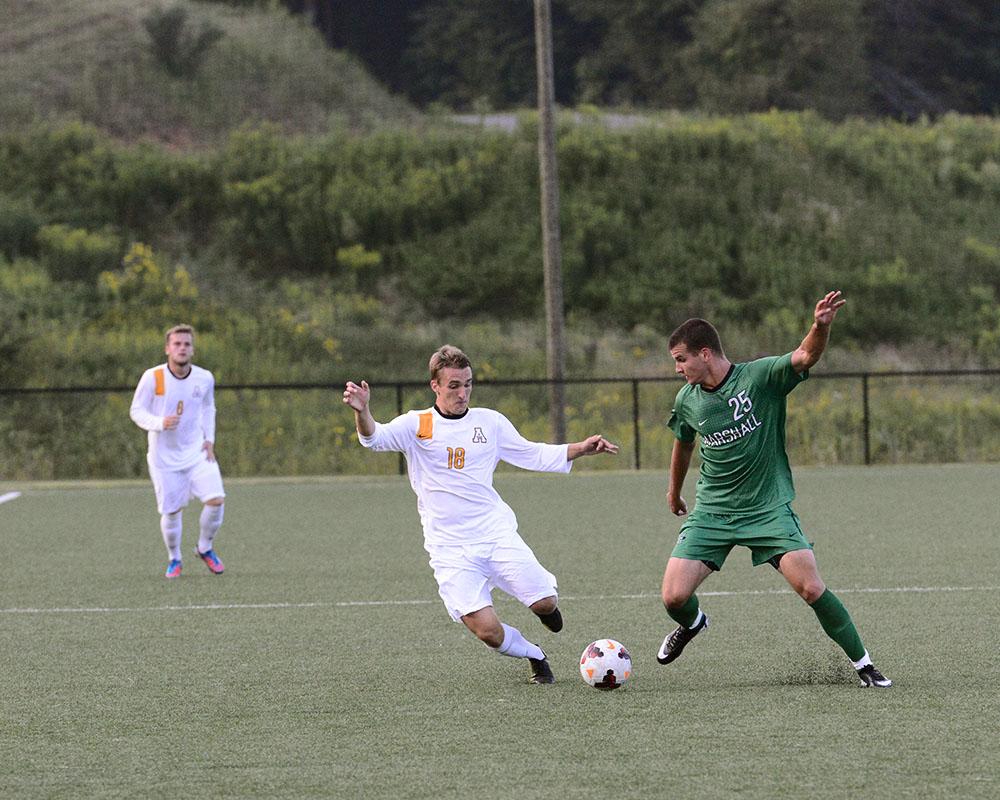 Sophomore mid-fielder Alex Herbst fights for control of the ball during Friday evening's match versus Marshall University. The Mountaineers tied with the Thundering Herd 0-0.  Photo by Courtney Roskos  |  The Appalachian