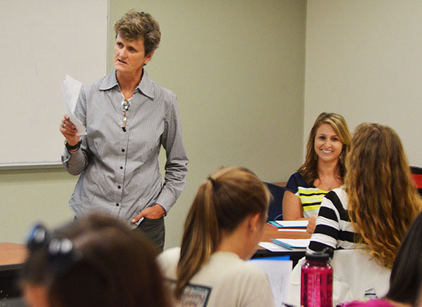 Professor Lisa Gross discusses recent North Carolina legislation with her curriculum and instruction class Monday. The state no longer requires schools to increase pay for teachers holding a master’s degree, prompting many education students to reconsider pursuing graduate school. Photo by Maggie Cozens  |  The Appalachian