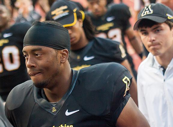 Sophomore quarterback Kameron Bryant walks off the field to the locker room after a disappointing first half against N.C. A&T.  Photo by Paul Heckert  |  The Appalachian