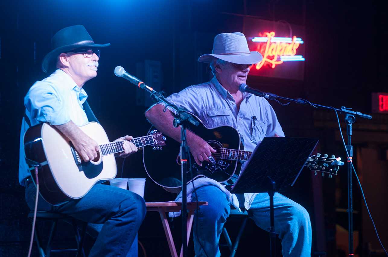 Jim Avett performs with his friend Ray Morton at Legends on Friday. Avett played to the crowd in a modified version of the venue.  Photo by Rachel Krauza  |  The Appalachian