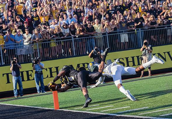 Freshman running back Marcus Cox stretches out for a first quarter touchdown in Saturday’s match-up against N.C. A&T. After a fourth-quarter surge, the team lost to the Aggies 24-21. Photo by Paul Heckert  |  The Appalachian