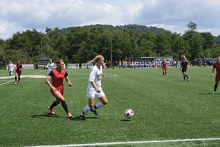 Sophomore forward Sam Childress dribbles the ball during the second home game of the season against Austin Peay. Photo by Courtney Roskos  |  The Appalachian