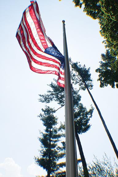 The flag in front of the B.B. Dougherty Administrative Building flies at half-staff in honor of the lives lost as a result of the 9/11 attacks. Photo by Rachel Krauza  |  The Appalachian