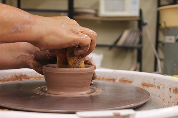 One of the experienced Craft Enrichment students throws a piece on the pottery wheel during Wednesday nights pottery class.The Craft Enrichment Program will begin spinning, video, weaving, and basket making classes later this year, all of which still have room for more artists. Photo by Molly Cogburn  |  The Appalachian