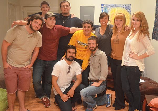 Members of the new production company Door No. 2 Productions pose for a group shot during a read-through for their upcoming performance of “The Twilight Zone.” The company was created by Appalachian students seeking to produce shows independently of the university. Photo by Maggie Cozens  |  The Appalachian