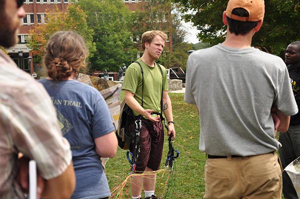 Benjamin Jordan, director of the film “The Boy Who Flies,” demonstrates paragliding and kite making to students on Sanford Mall on Friday. Approximately 40 students showed up to make kites out of newspaper and share their aspirations for the future. Photo by Justin Perry  |  The Appalachian