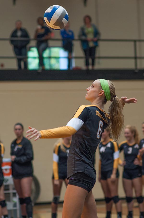 Sophomore outside hitter Emily Corrigan serves the ball during Sunday’s tournament match against the University of Texas at Arlington. Appalachian State won the Black and Gold Challenge after defeating UT Arlington and Denver. Photo by Justin Perry  |  The Appalachian