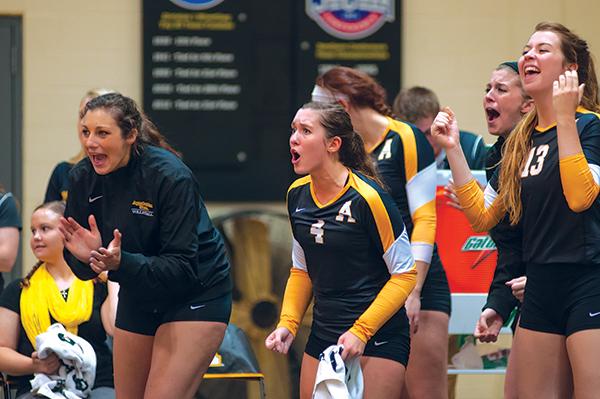 The volleyball team cheers during the third game of the Black and Gold Challenge match against the University of Texas at Arlington. Photo by Justin Perry  |  The Appalachian